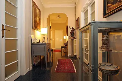 a hallway with a door open to a room at Amica Roma Guest House in Rome