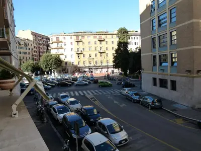 a parking lot full of cars in a city at Amica Roma Guest House in Rome