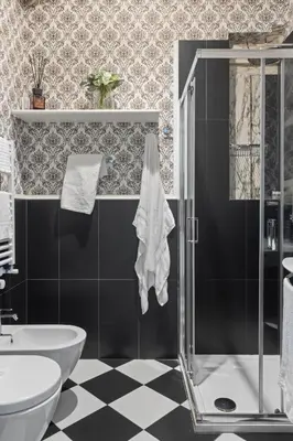 a bathroom with a shower and a toilet and a sink at GHR Navona Inn in Rome