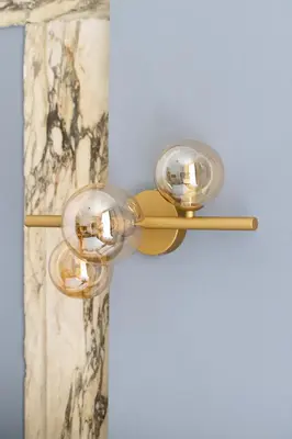 a pair of glass sconce on a wall at GHR Navona Inn in Rome
