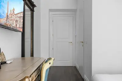 a dining room with a table and chairs at GHR Navona Inn in Rome