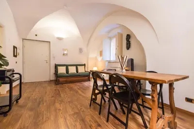 a dining room with a table and chairs at Lovely New Home, Via Nazionale in Rome