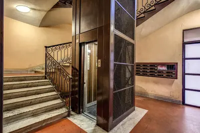 an entrance to a house with stairs and a door at AMICI GUESTHOUSE in Rome