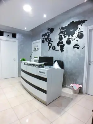 a room with a counter with a world map on the wall at Babyface in Rome