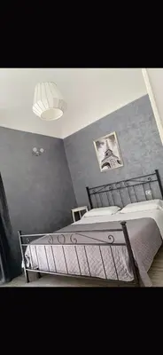 a bedroom with two beds and a ceiling at Babyface in Rome