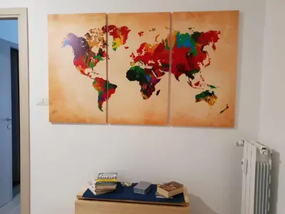 a painting of a world map on a wall at 550 Special home in Rome