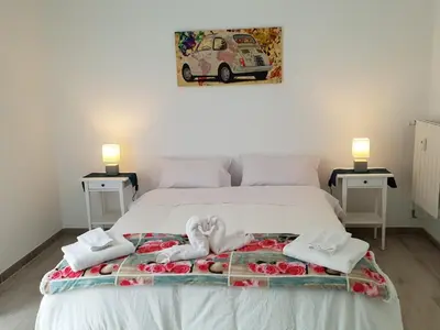 a bedroom with a bed with towels on it at 550 Special home in Rome
