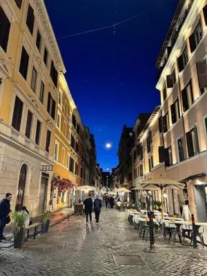 a group of people walking down a street at night at San Peter Apartment - your home in the heart of Rome in Rome