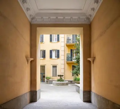 an open hallway with a building in the background at Sky Blue Place Rome in Rome