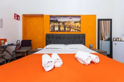 a bedroom with a bed with two white towels at Imperiale Top in Rome