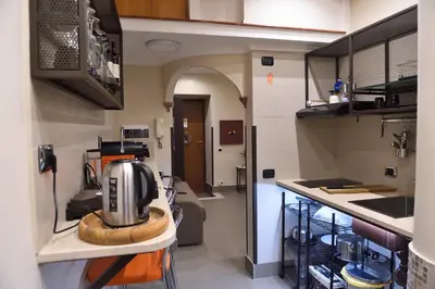a kitchen with a coffee maker on a counter at Domus Catone in Rome