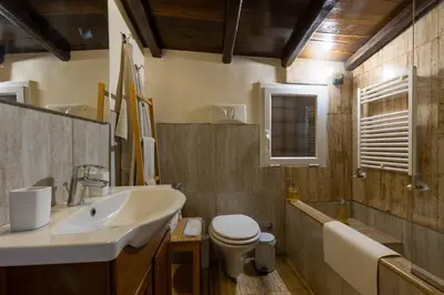 a bathroom with a sink and a toilet at Colosseum private terrace in Rome