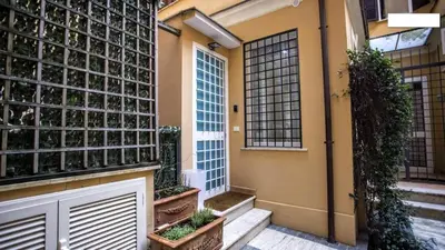a entrance to a house with plants on the wall at Colosseum private terrace in Rome