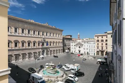 a view of a city street with cars and buildings at Farnese Charming Apartment in Rome