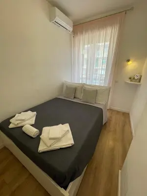 a bedroom with a large bed with towels on it at Trastevere Sweet Rest in Rome