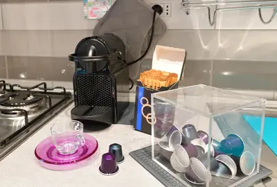 a kitchen counter with a blender and a container of spoons at San Pietro Moonlight Luxury Apartment in Rome