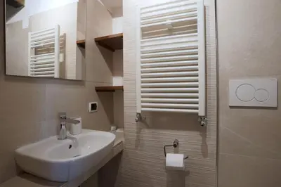 a bathroom with a sink and a mirror at Borgo Pio 91 in Rome