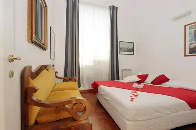a bedroom with a bed and a chair in it at Sanctuary Home in Rome