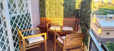 a balcony with chairs and a table on a balcony at Pigneto Suite appartamento 50 m da metro C in Rome