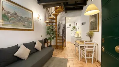 a living room with a couch and a table at Karma House Deluxe Navona in Rome
