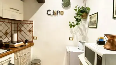 a kitchen with a sink and a counter top at Karma House Deluxe Navona in Rome