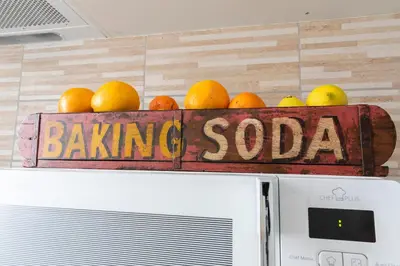 a sign with oranges and lemons on top of a refrigerator at Casa Otto in Rome