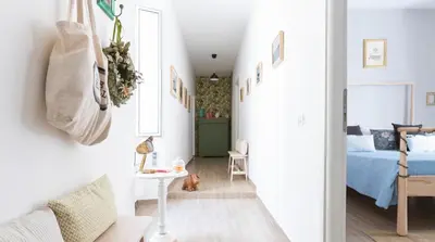 a hallway with a bed and a dog in a room at Casa Otto in Rome