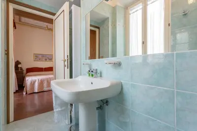 a bathroom with a sink and a mirror at Vittoria Street Charming in Rome