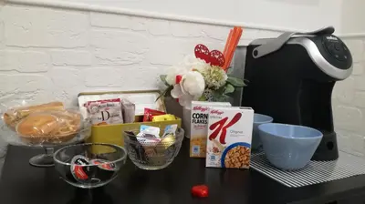 a table with food and other items on it at Vatican City Holidays Guesthouse in Rome