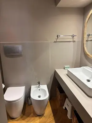 a bathroom with a toilet and a sink at Luxury Laura Vatican Apartment ROMA CENTRO in Rome