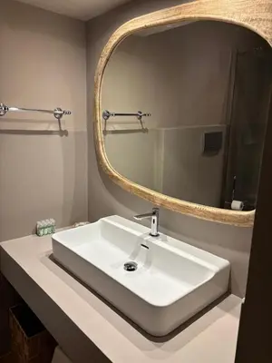 a bathroom with a white sink and a mirror at Luxury Laura Vatican Apartment ROMA CENTRO in Rome