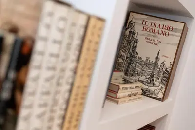 a book shelf with books on top at Luxury Laura Vatican Apartment ROMA CENTRO in Rome