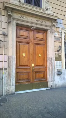 a large wooden door on the side of a building at Le Stanze Di Elle in Rome