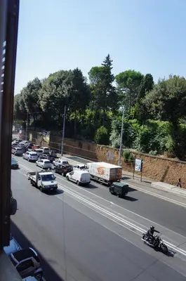a highway filled with traffic with cars and a truck at Le Stanze Di Elle in Rome