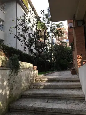 a set of stairs in front of a building at GLI ARANCI Apartment in Rome