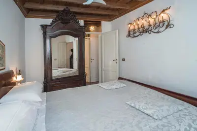 a bedroom with a bed and a large mirror at Indimenticabili VACANZE ROMANE nel cuore della città in Rome