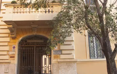 an entrance to a building with a black gate at Il Melograno Holiday House in Rome