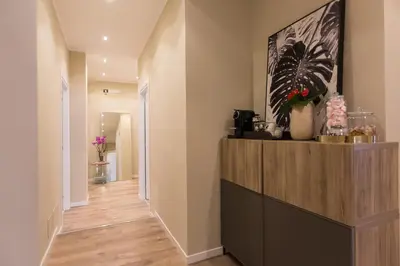 a hallway of a home with a wooden floor at 126 Gracchi Suites in Rome