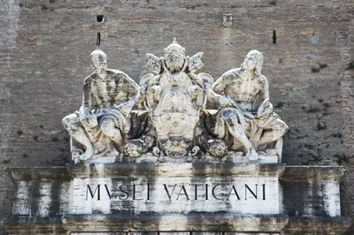 a statue of three men on a wall at Vaticano84 in Rome