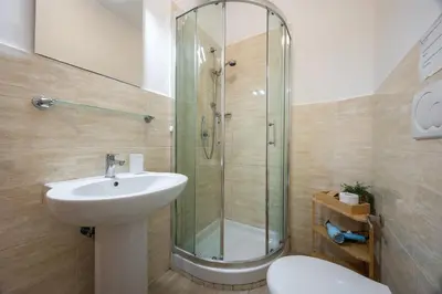 a bathroom with a shower and a sink and a toilet at Vaticano84 in Rome