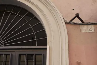a door of a building with an arched window at Arcadia apartments in Rome