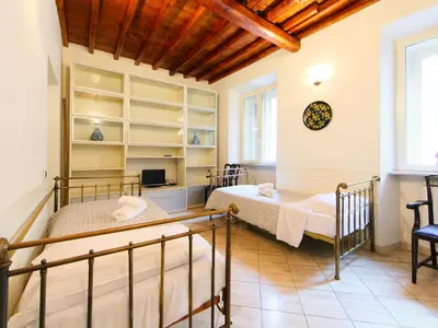 a bedroom with two beds in a room at Apartment Vittorio Emanuele-1 by Interhome in Rome