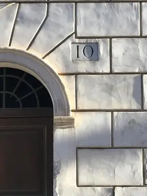 a building with a door with the number on it at Private Modern Studio Paolina City Center in Rome