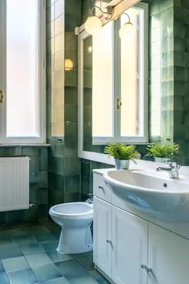 a bathroom with a sink and a toilet at Vatican Apartment Borgo Pio in Rome