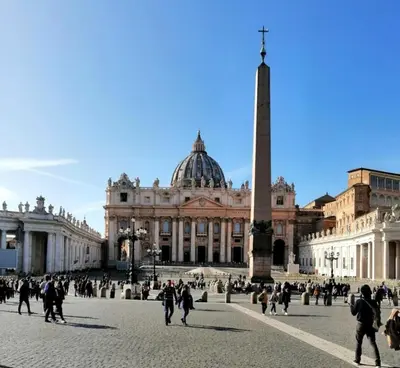 a group of people walking in front of a building at Vatican Apartment Borgo Pio in Rome