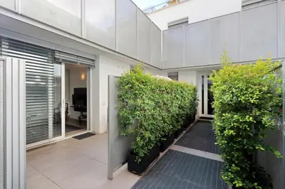 a building with plants on the side of it at Piazza del Popolo Apartment in Rome