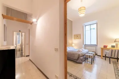 a bedroom with a bed and a living room at Elizabeth House - WelcomeToRhome in Rome