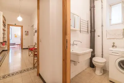 a bathroom with a toilet and a sink at Elizabeth House - WelcomeToRhome in Rome