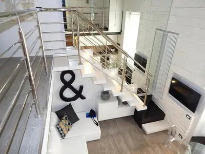 an overhead view of a staircase in a house at Modern Loft Walk to St Peter IREX Apartment in Rome