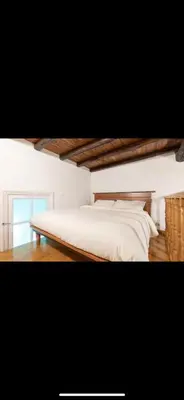 a bedroom with a white bed and a window at IN FRONT OF COLISEUM 3 in Rome
